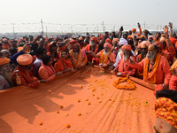 Indian Sadhus (Hindu holy men) gather during the Dharam Dhwaja (religious flag) ceremony at the Sangam area, ahead of the upcoming Maha Kumb...