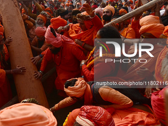 Indian Sadhus (Hindu holy men) gather during the Dharam Dhwaja (religious flag) ceremony at the Sangam area, ahead of the upcoming Maha Kumb...