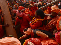 Indian Sadhus (Hindu holy men) gather during the Dharam Dhwaja (religious flag) ceremony at the Sangam area, ahead of the upcoming Maha Kumb...