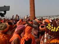 Indian Sadhus (Hindu holy men) gather during the Dharam Dhwaja (religious flag) ceremony at the Sangam area, ahead of the upcoming Maha Kumb...