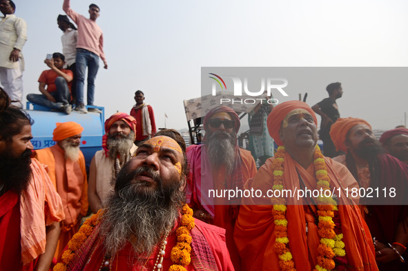 Indian Sadhus (Hindu holy men) gather during the Dharam Dhwaja (religious flag) ceremony at the Sangam area, ahead of the upcoming Maha Kumb...