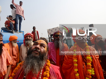 Indian Sadhus (Hindu holy men) gather during the Dharam Dhwaja (religious flag) ceremony at the Sangam area, ahead of the upcoming Maha Kumb...