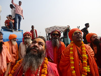 Indian Sadhus (Hindu holy men) gather during the Dharam Dhwaja (religious flag) ceremony at the Sangam area, ahead of the upcoming Maha Kumb...