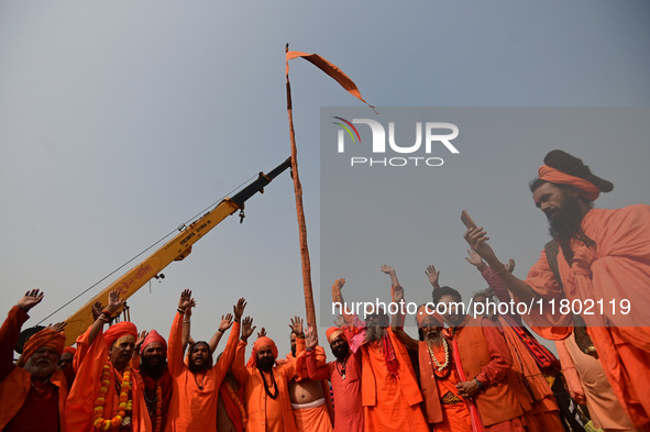 Indian Sadhus (Hindu holy men) gather during the Dharam Dhwaja (religious flag) ceremony at the Sangam area, ahead of the upcoming Maha Kumb...