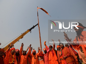 Indian Sadhus (Hindu holy men) gather during the Dharam Dhwaja (religious flag) ceremony at the Sangam area, ahead of the upcoming Maha Kumb...