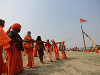 Indian Sadhus (Hindu holy men) gather during the Dharam Dhwaja (religious flag) ceremony at the Sangam area, ahead of the upcoming Maha Kumb...