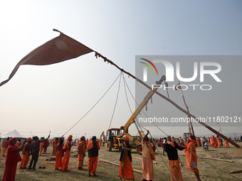 Indian Sadhus (Hindu holy men) gather during the Dharam Dhwaja (religious flag) ceremony at the Sangam area, ahead of the upcoming Maha Kumb...