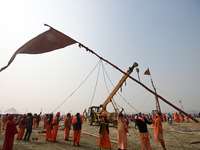 Indian Sadhus (Hindu holy men) gather during the Dharam Dhwaja (religious flag) ceremony at the Sangam area, ahead of the upcoming Maha Kumb...