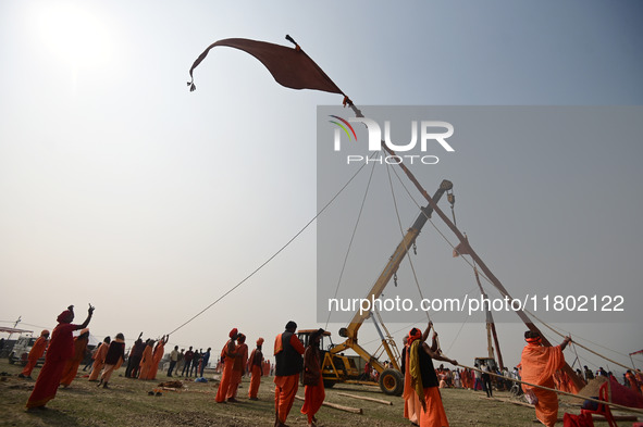 Indian Sadhus (Hindu holy men) gather during the Dharam Dhwaja (religious flag) ceremony at the Sangam area, ahead of the upcoming Maha Kumb...