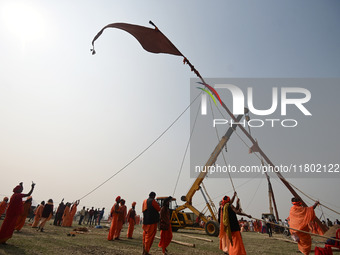 Indian Sadhus (Hindu holy men) gather during the Dharam Dhwaja (religious flag) ceremony at the Sangam area, ahead of the upcoming Maha Kumb...