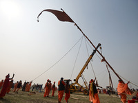 Indian Sadhus (Hindu holy men) gather during the Dharam Dhwaja (religious flag) ceremony at the Sangam area, ahead of the upcoming Maha Kumb...