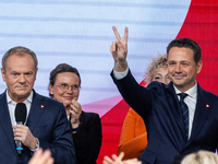 Polish PM Donald Tusk and Mayor Rafal Trzaskowski (R) celebrate after Trzaskowski win in the Civic Platform primary with over 75% votes and...