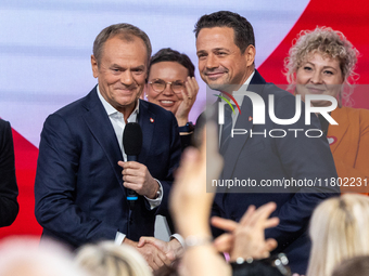 Donald Tusk (L) congratulates Warsaw Mayor Rafal Trzaskowski after the announcement by the National Council of Civic Platform that he is the...