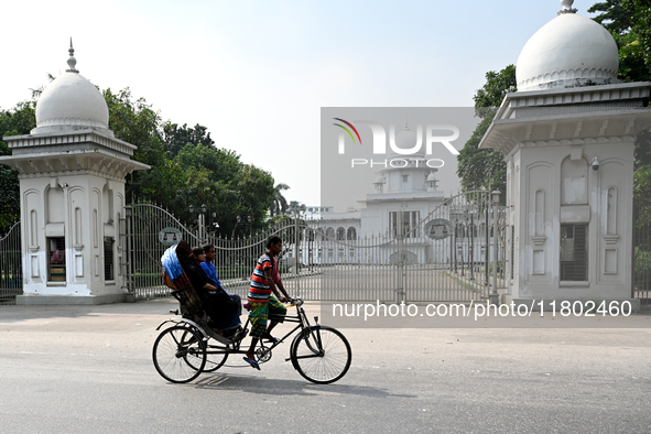 A rickshaw puller rides in front of the high court in Dhaka, Bangladesh, on November 23, 2024 