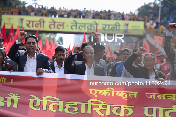 Netra Bikram Chand (Center), the leader and chairman of the Nepal Communist Party, takes part in a march organized in Kathmandu, Nepal, on N...