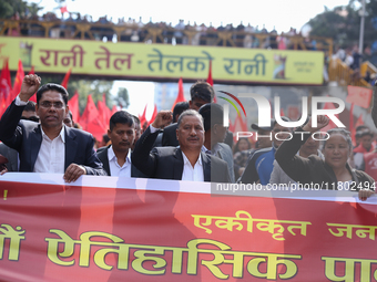 Netra Bikram Chand (Center), the leader and chairman of the Nepal Communist Party, takes part in a march organized in Kathmandu, Nepal, on N...