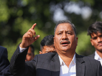 Netra Bikram Chand (Center), the leader and chairman of the Nepal Communist Party, takes part in a march organized in Kathmandu, Nepal, on N...