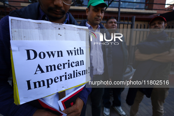 Nepali activists hold banners and placards with slogans demanding an end to Israel's aggression on Palestine during a demonstration in Kathm...