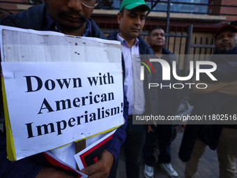 Nepali activists hold banners and placards with slogans demanding an end to Israel's aggression on Palestine during a demonstration in Kathm...