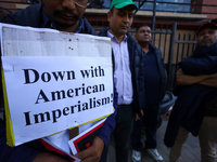 Nepali activists hold banners and placards with slogans demanding an end to Israel's aggression on Palestine during a demonstration in Kathm...