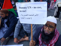 Nepali activists hold banners and placards with slogans demanding an end to Israel's aggression on Palestine during a demonstration in Kathm...