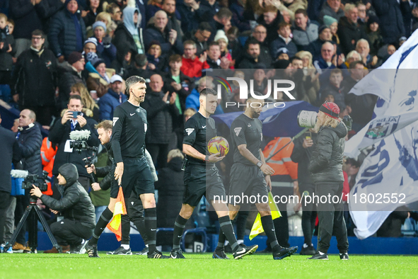 Referee Lewis Smith (with ball) leads the teams out during the Sky Bet Championship match between West Bromwich Albion and Norwich City at T...