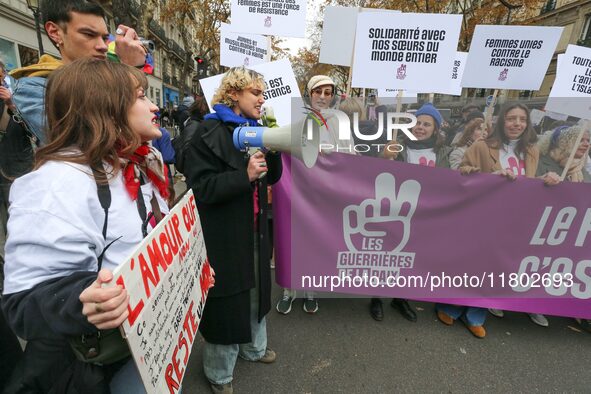 Demonstrators hold a banner as they participate in a protest to condemn violence against women, organized by feminist organizations two days...