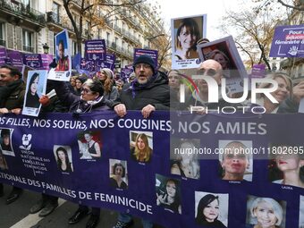 Demonstrators hold a banner as they participate in a protest to condemn violence against women, organized by feminist organizations two days...