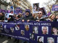 Demonstrators hold a banner as they participate in a protest to condemn violence against women, organized by feminist organizations two days...