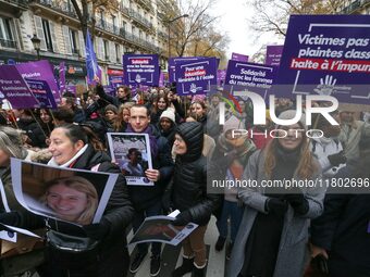 Demonstrators hold placards as they participate in a protest to condemn violence against women, organized by feminist organizations, in Pari...