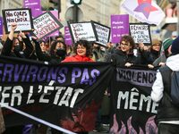 Demonstrators hold a banner as they participate in a protest to condemn violence against women, organized by feminist organizations two days...