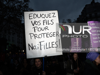 A demonstrator holds a placard reading ''educate your sons to protect our daughters'' during a protest to condemn violence against women, ca...