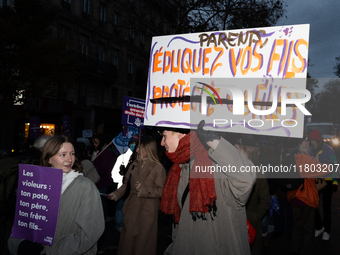 A demonstrator holds a placard reading ''Parents educate your sons'' during a protest to condemn violence against women, called by feminist...