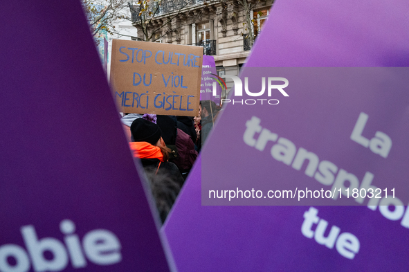 A demonstrator holds a placard reading ''stop rape culture, thank you Gisele'' during a protest to condemn violence against women, called by...