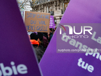 A demonstrator holds a placard reading ''stop rape culture, thank you Gisele'' during a protest to condemn violence against women, called by...