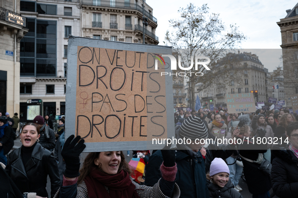 A demonstrator holds a placard reading ''we want rights not blows'' during a protest to condemn violence against women, called by feminist o...