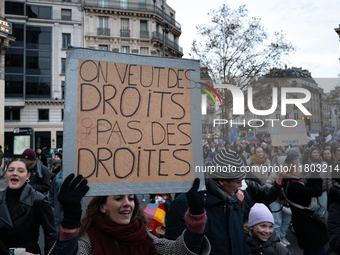 A demonstrator holds a placard reading ''we want rights not blows'' during a protest to condemn violence against women, called by feminist o...