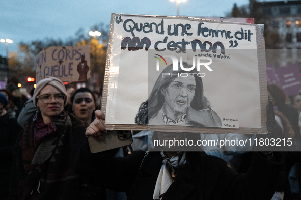 A demonstrator holds a placard reading ''when a woman says no, it's no, Gisele Halim'' during a protest to condemn violence against women, c...