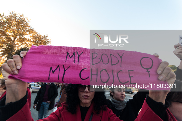 Women participate in a demonstration prior to the 'International Day for the Elimination of Violence against Women' in Rome, Italy, on Novem...