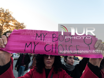 Women participate in a demonstration prior to the 'International Day for the Elimination of Violence against Women' in Rome, Italy, on Novem...