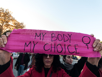 Women participate in a demonstration prior to the 'International Day for the Elimination of Violence against Women' in Rome, Italy, on Novem...