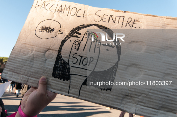 Women participate in a demonstration prior to the 'International Day for the Elimination of Violence against Women' in Rome, Italy, on Novem...