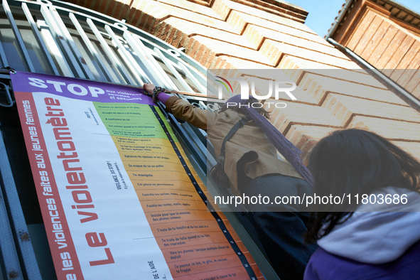 A young woman places a 'violencemeter' on a window. Women from the collective NousToutes and other organizations such as SUD or Amnesty Inte...