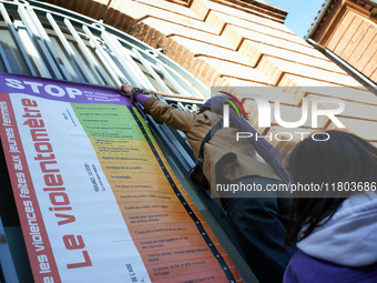 A young woman places a 'violencemeter' on a window. Women from the collective NousToutes and other organizations such as SUD or Amnesty Inte...