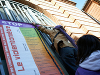 A young woman places a 'violencemeter' on a window. Women from the collective NousToutes and other organizations such as SUD or Amnesty Inte...