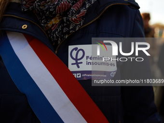 A deputy wears a sticker reading 'Feminist unbowed'. Women from the collective NousToutes and other organizations such as SUD or Amnesty Int...