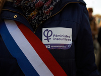 A deputy wears a sticker reading 'Feminist unbowed'. Women from the collective NousToutes and other organizations such as SUD or Amnesty Int...