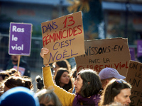 A woman holds a placard reading 'In 13 feminicides, it will be Christmas'. Women from the collective NousToutes and other organizations such...