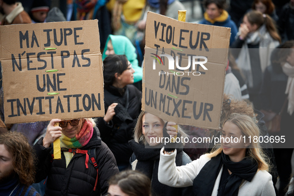 Placards read 'My skirt isn't an invitation' and 'Rapist your dick in a blender'. Women from the collective NousToutes and other organizatio...