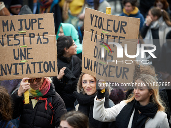 Placards read 'My skirt isn't an invitation' and 'Rapist your dick in a blender'. Women from the collective NousToutes and other organizatio...